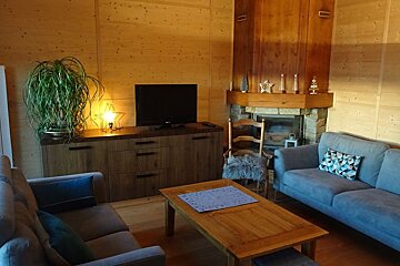 A living room with a couch and a flat screen tv