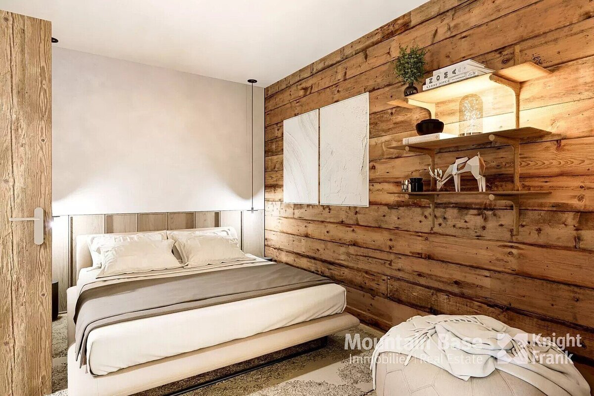 A bedroom with a wooden wall and a bed and a sign that says frank