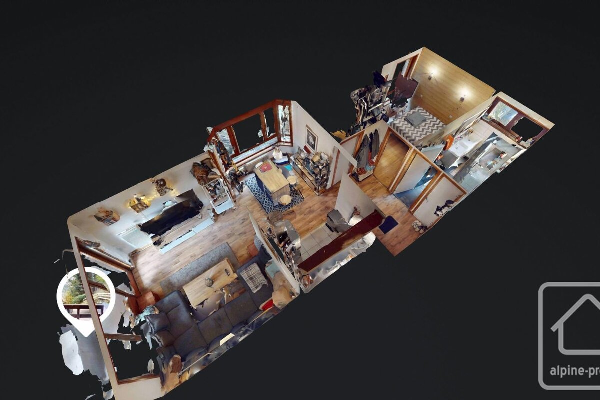 A 3D virtual tour render of a rustic, furnished house interior from an aerial perspective, showing living, kitchen, and bedroom areas.