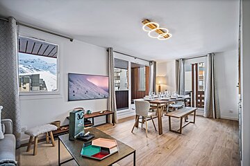 A dining room table with plates and glasses on it