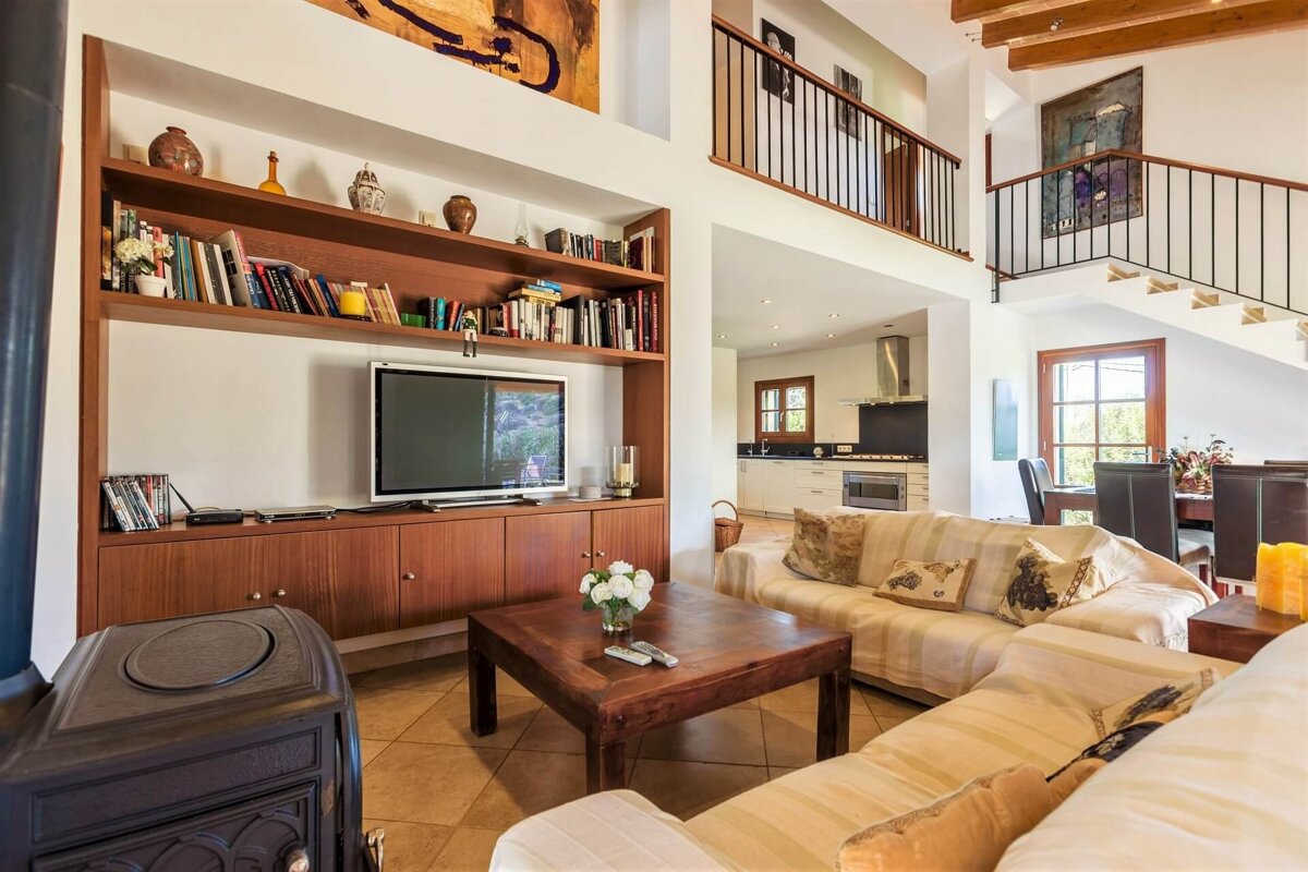 A living room with a couch and a flat screen tv