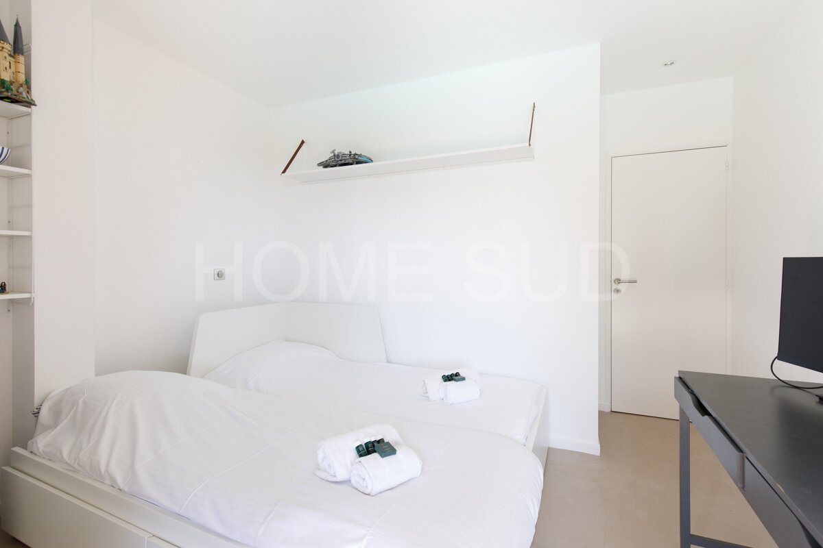 A bedroom with the word home on the wall