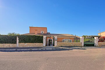 A house with a fence and a sign that says ' a ' on it