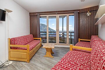 A living room with a couch and a television