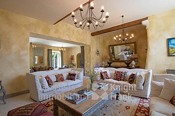 A living room with a couch that says knight frank on it