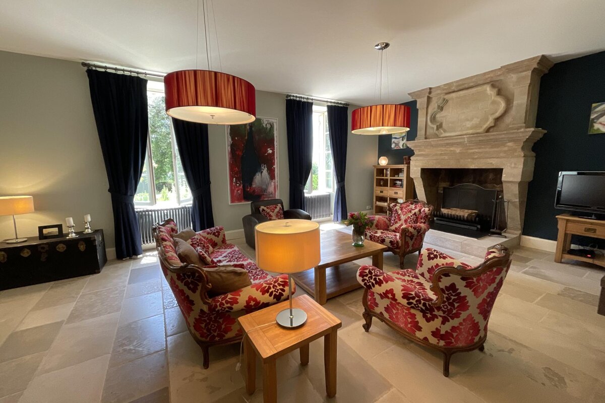 A living room filled with furniture and a fireplace