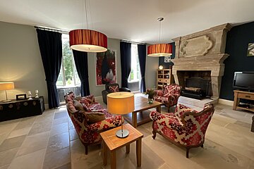 A living room filled with furniture and a fireplace