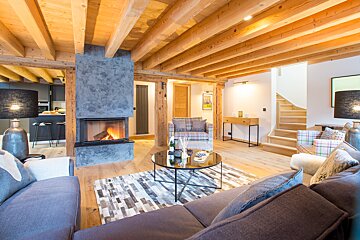 A living room with a fireplace and a couch