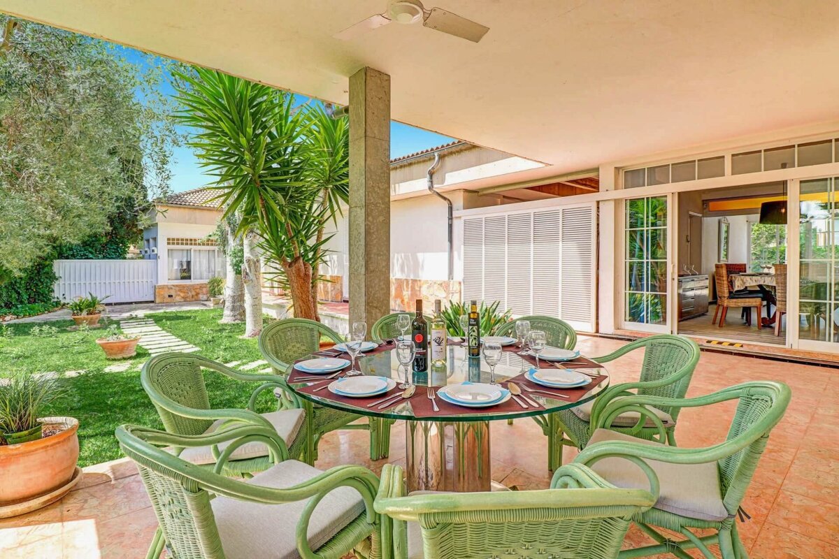 A table with plates and a bottle of wine on it