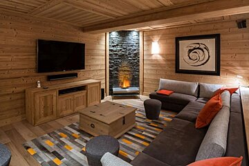 A living room with a couch and a flat screen tv