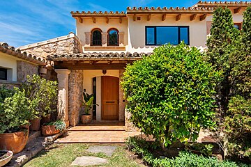 The front of a house with a wooden door