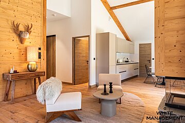 A bedroom with bunk beds and a mirror on the wall