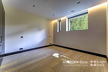 A room with a window and a sign that says mountain base