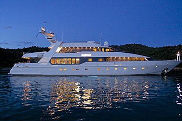 A large white yacht with the word ruffian on the side