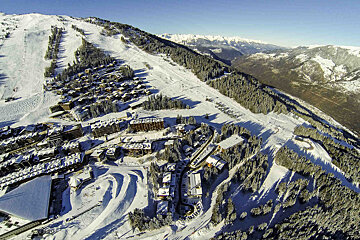 An aerial view of a ski resort in the mountains