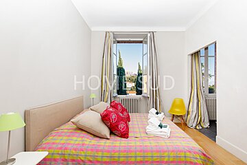 A bedroom with the word home on the wall