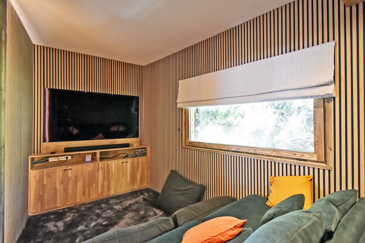 A living room with a couch and a flat screen tv