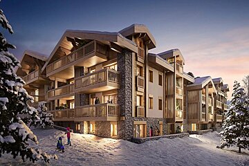 A snow-covered alpine building with wood and stone architecture glows warmly at dusk. Children play in the foreground amidst snowy pine trees.