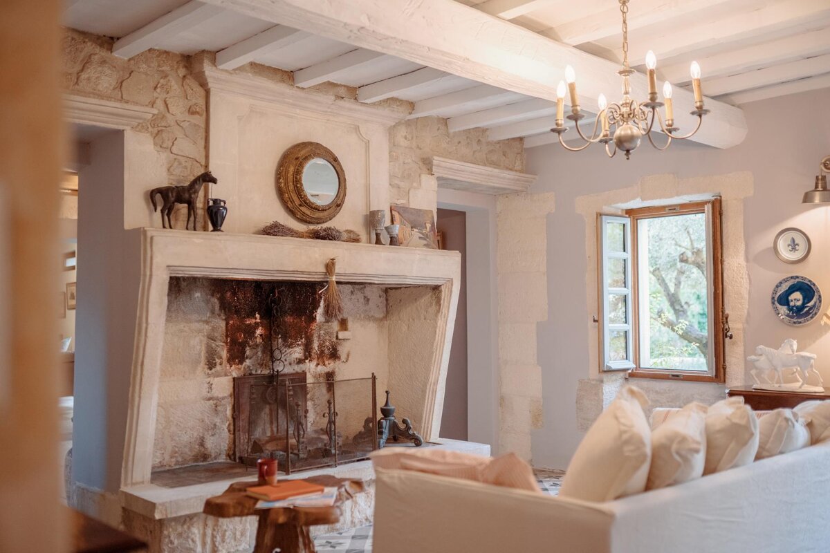 A living room with a fireplace and a couch