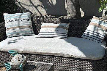A couch with a pillow that says st raphael on it