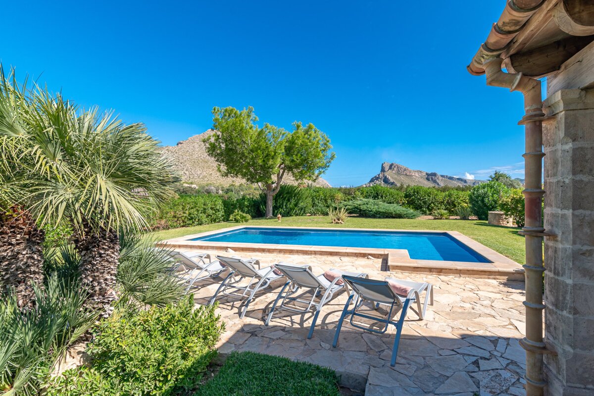 A swimming pool with a mountain in the background