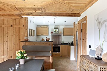 A kitchen with wooden cabinets and stainless steel appliances