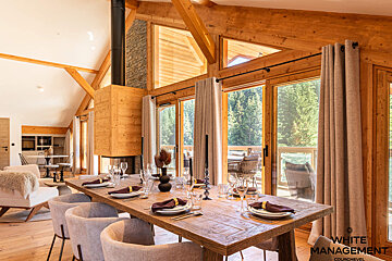 A bedroom with a bed and a picture on the wall