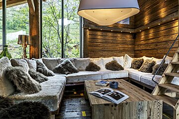 A living room with a couch and a book on a table