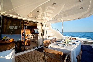 A boat with a table and chairs on it