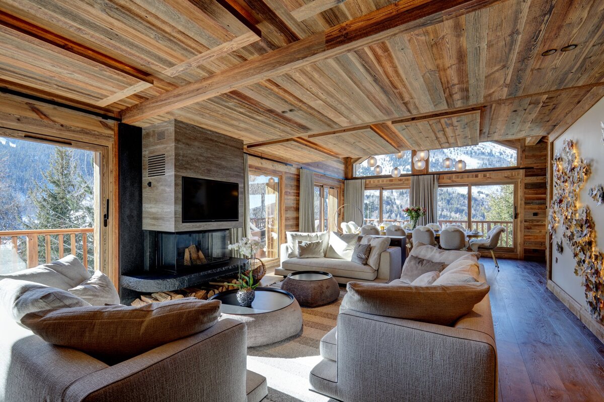 A living room with a fireplace and a flat screen tv