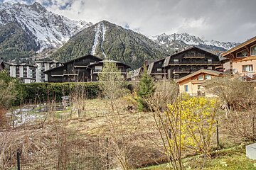 The mountains are visible behind the houses in the foreground
