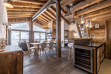 A kitchen with a wine cooler in it