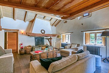 A living room filled with furniture and a fireplace