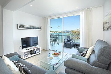 A living room with a couch and a flat screen tv