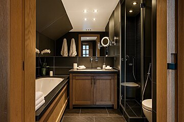 A bathroom with a sink and a toilet