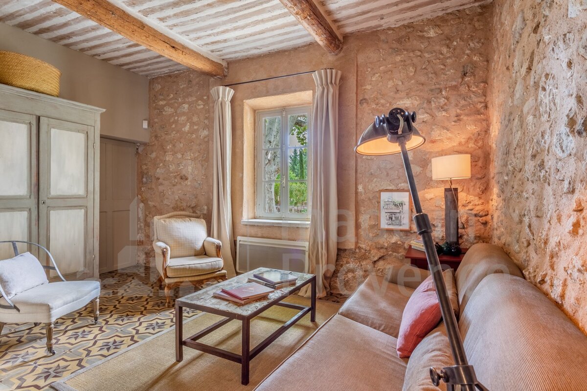 A living room with a stone wall and a couch