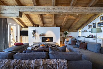 A living room with a fireplace and a couch