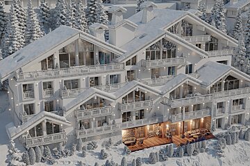 An aerial view of a building with snow on the roof