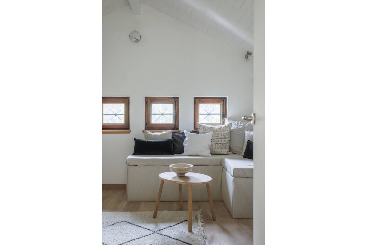 A living room with a couch and a small table