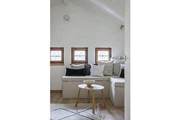 A living room with a couch and a small table