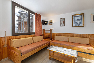 A living room with a couch and a table