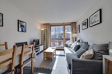A living room with a couch and a television