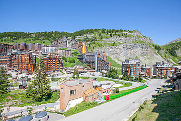 A city with a lot of buildings on a hillside