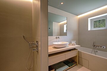 A bathroom with a sink and a bathtub