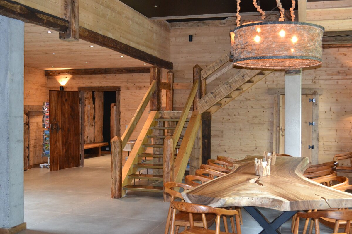 A wooden staircase leads up to the second floor