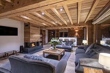 A living room filled with furniture and a fireplace