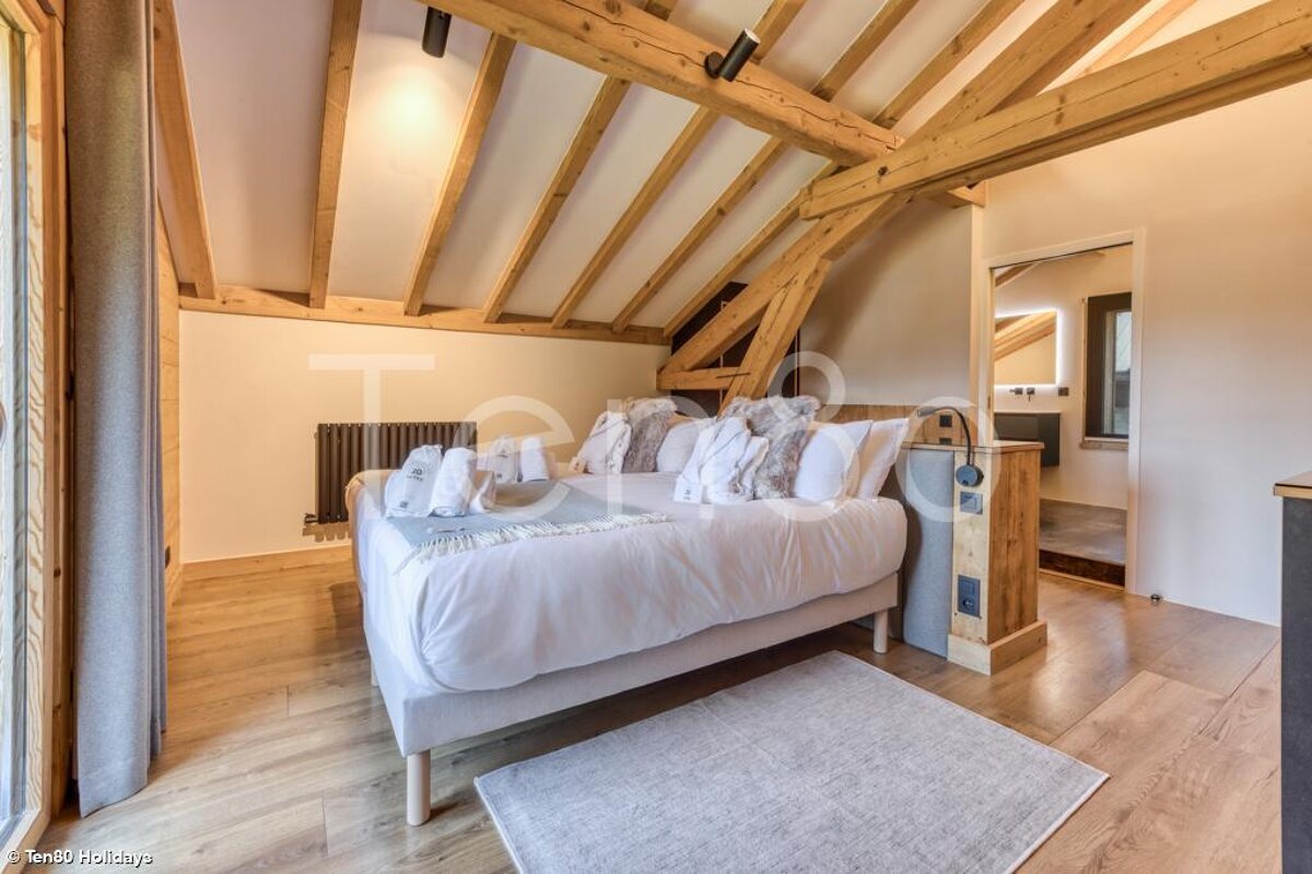 A bedroom with a bed and a sign that says holidays