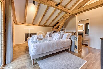 A bedroom with a bed and a sign that says holidays