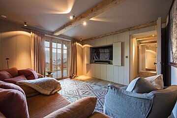 A living room with a couch and a television