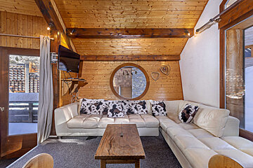A living room with a couch and a television